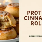 Freshly baked Protein Cinnamon Rolls with a golden-brown swirl, icing drizzle, and a text section on the side featuring bold, rustic lettering